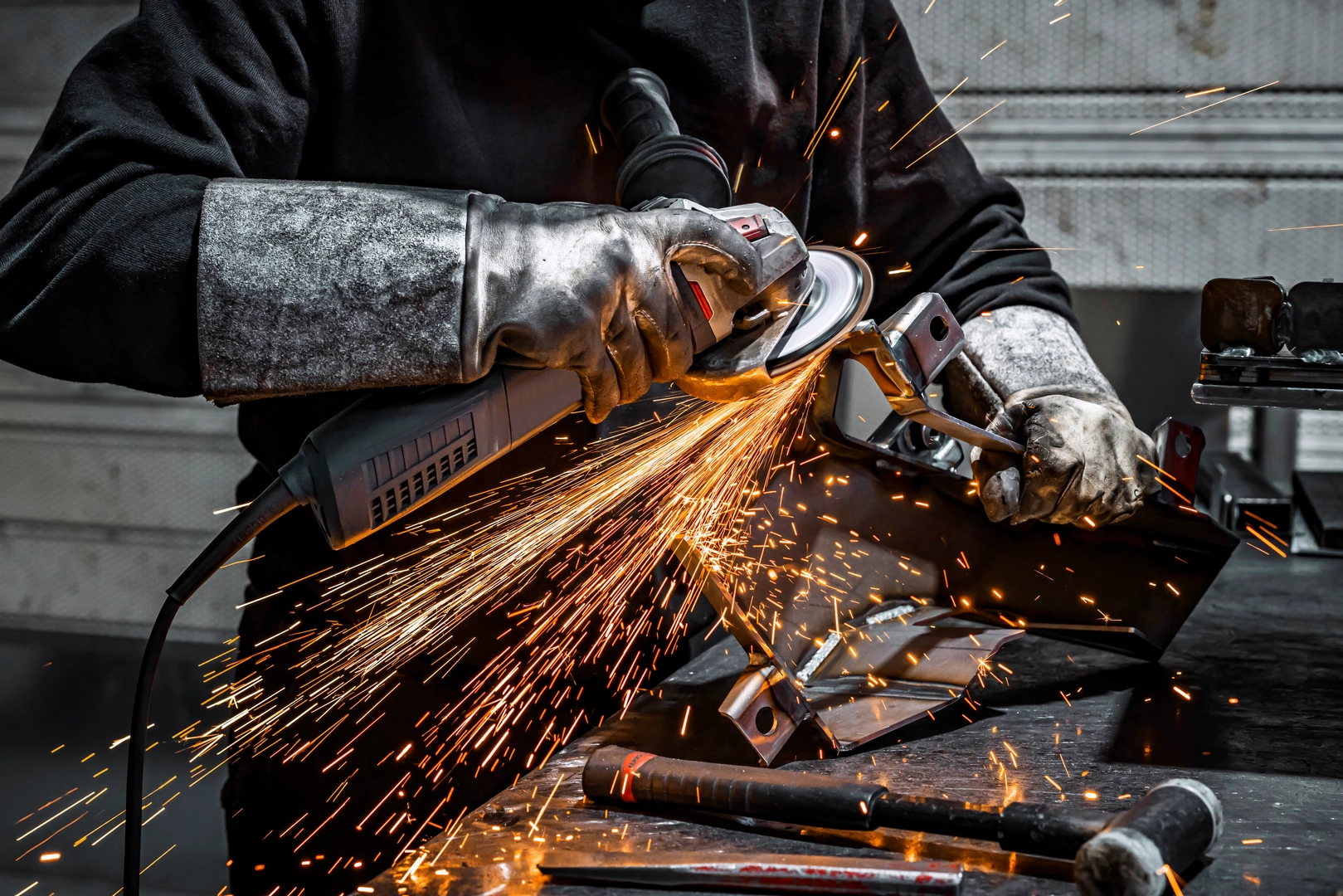 view-worker-grinding-piece-metal